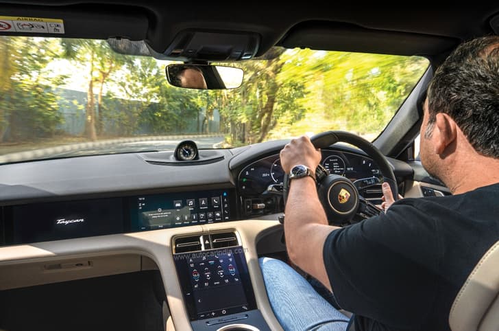 Porsche Taycan interior driving image