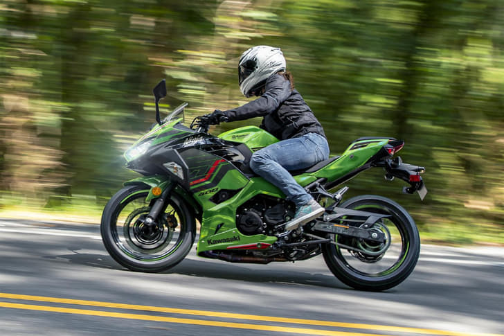 Dynamic riding shot of the Kawasaki Ninja 400.