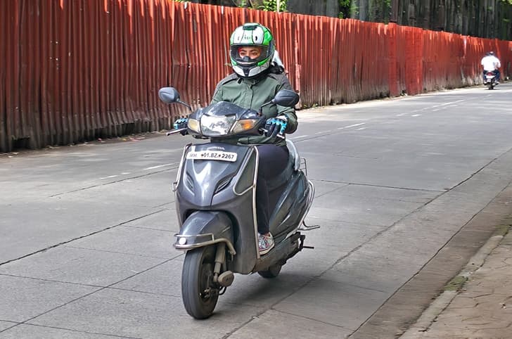 Lady riding Honda Activa in India