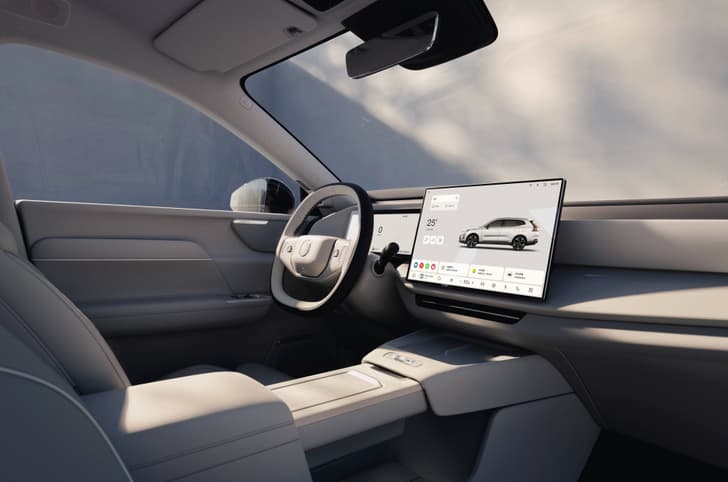 Volvo XC70 interior shows touchscreen and steering wheel
