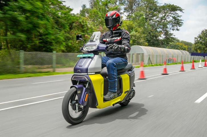 TVS Orbiter front left side riding shot on track