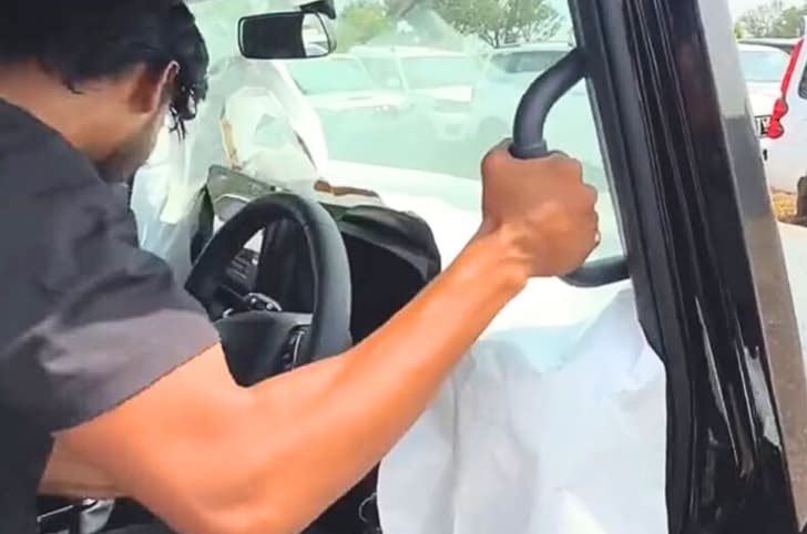 new mahindra thar facelift interior spy shot new features new mahindra thar facelift interior grab handle