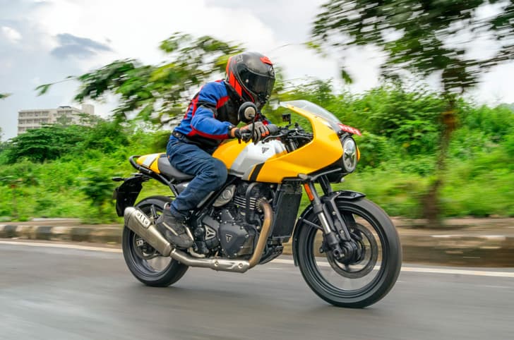 Triumph Thruxton 400 front three fourth tracking shot
