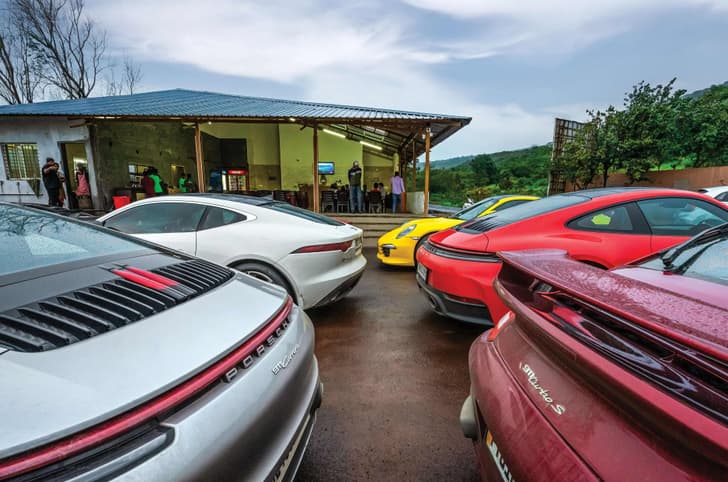 Multiple Porsches parked