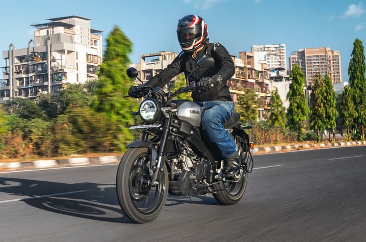 Yamaha XSR155 front left side riding shot in city
