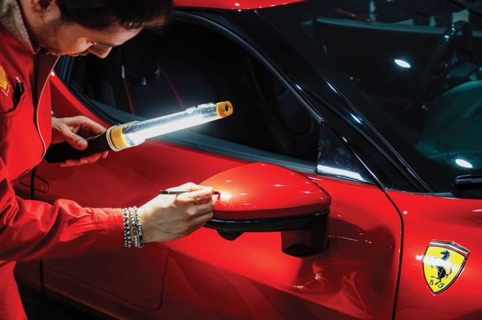 Used Ferrari being inspected