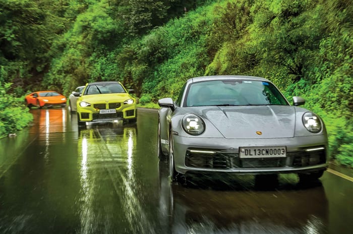 Porsche 911 BMW M2 and Lamborghini Huracan on the road