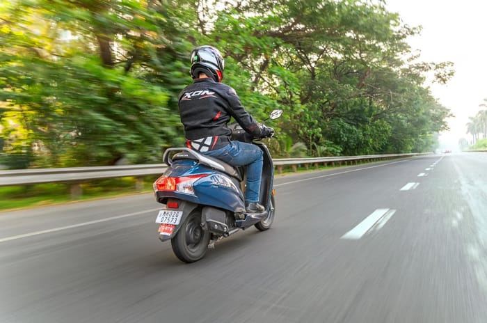 Honda Activa rear right side riding shot on road