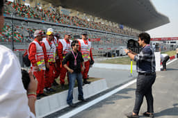 Pit marshals strike a pose for the camera.