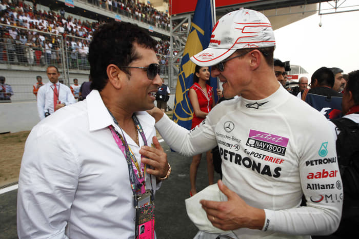When two legends meet – Michael Schumacher shares a word with his friend Sachin Tendulkar.