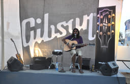 The Gibson stall. Anyone could pick up a guitar and strum away.