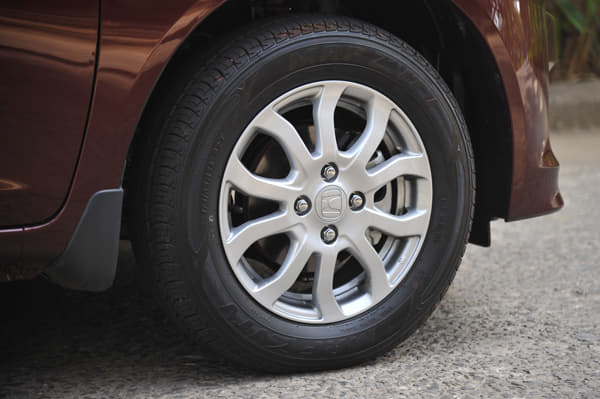 Amaze petrol gets a different alloy-wheel design. 