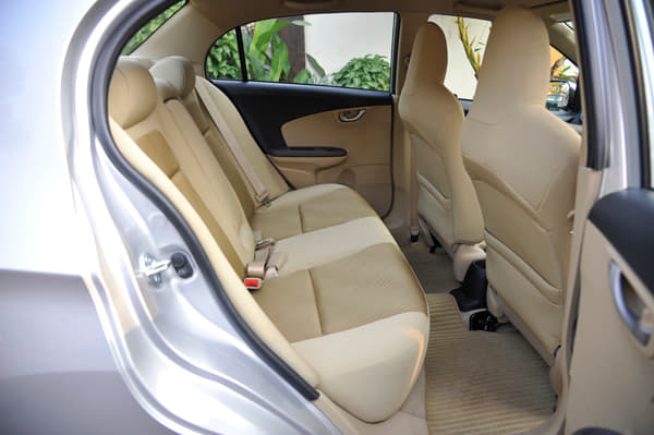 Rear seat cushioning is thicker than the Brio. Ample legroom as well. 