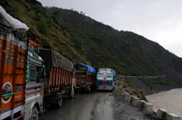Truck drivers spent the night waiting for the landslide debris to be cleared.