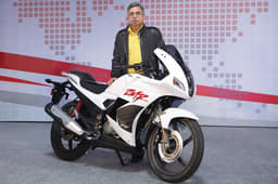 Mr. Munjal poses with the brand's new 2014 Karizma ZMR