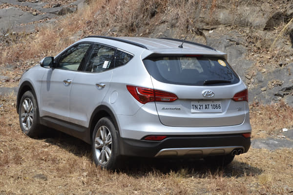 Window line curves upwards towards the rear, giving it a coupé-like appearance.