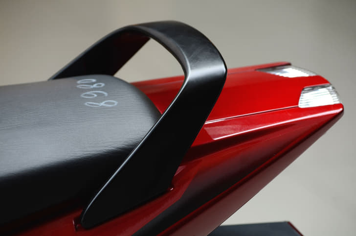 Silver colored grab rail is replaced by an alloy grab rail finished in black.