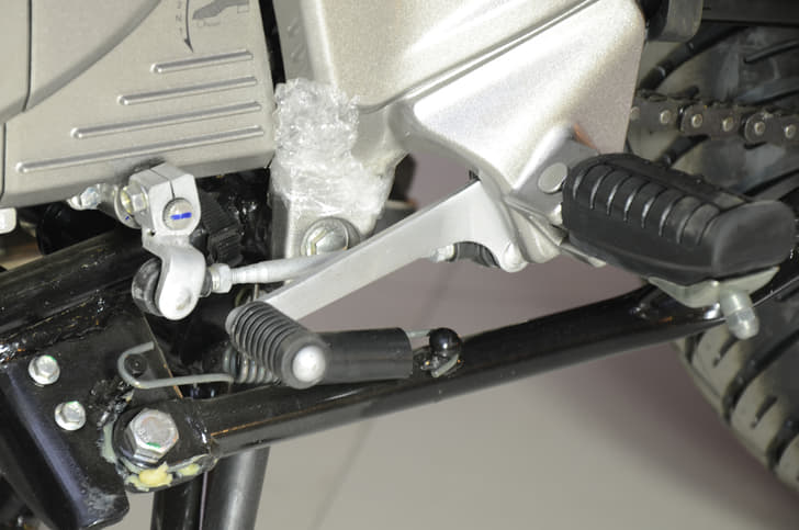  The five-speed gearbox shifts in the one-down four-up pattern. 