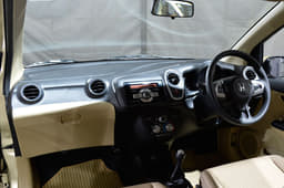 The dashboard is packed close to the windscreen.