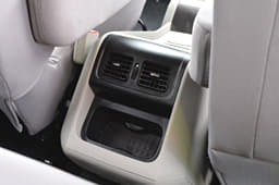 Middle passengers get AC vents and some storage space.