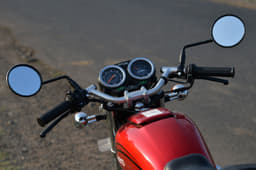 Analogue display has a side-stand engage light. M-type handlebar often used for café racer styling.