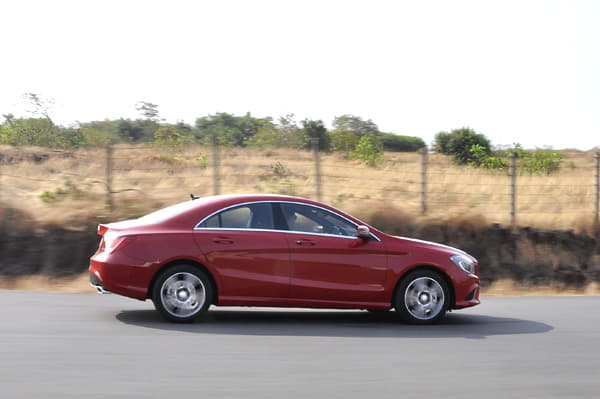 The sides are full of curvy creases and they converge in a compact rear with a pair of neat LED tail-lamps. 