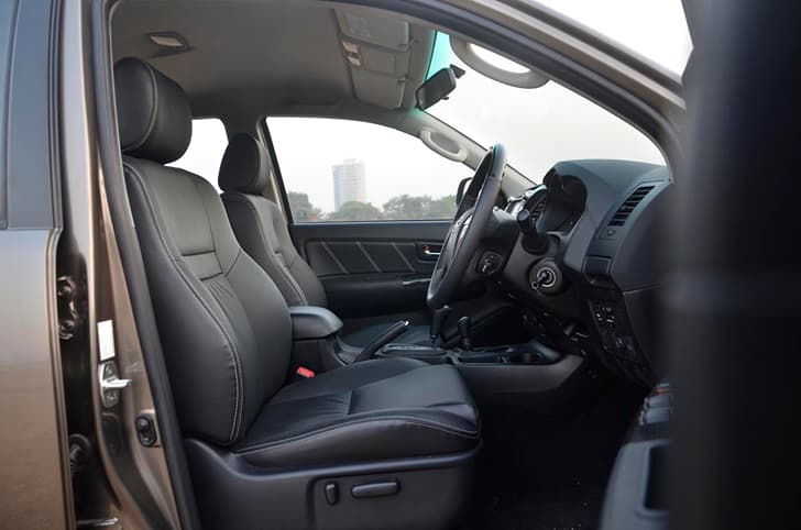 The all-black interior theme continues on the front and rear seats. 