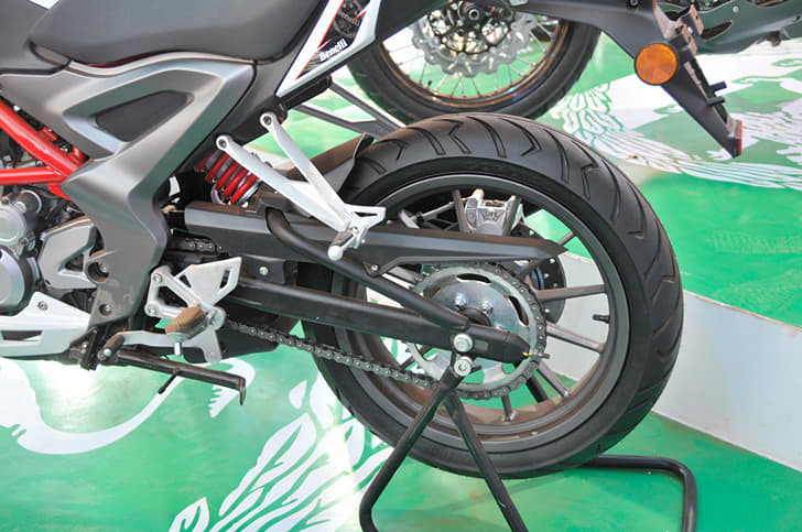 Monoshock does suspension duty at rear, mounted on a box-section swingarm and  chain final drive.   