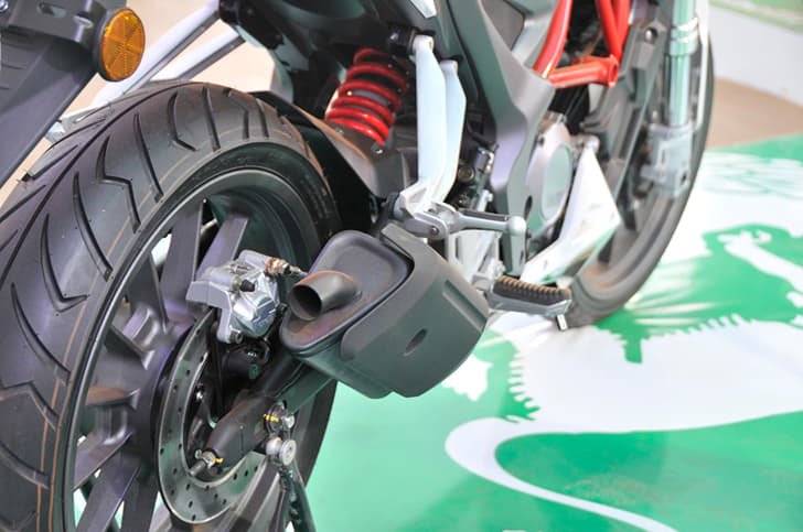 Short silencer is finished in black, monoshock is seen at rear with a box-section swingarm. 