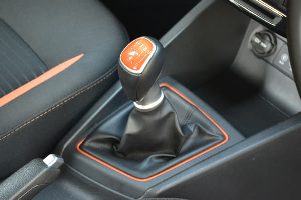 Gear lever gets orange inserts.