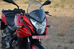 The really tall and see-through visor on the Bajaj Pulsar AS 150; a potent projector headlight illuminates the roads well at night.