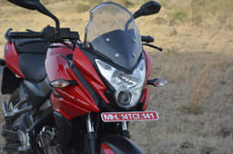 The really tall and see-through visor on the Bajaj Pulsar AS 150; a potent projector headlight illuminates the roads well at night.