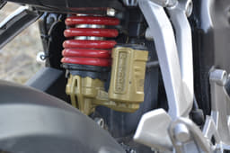 Six-way adjustable rear monoshock is charged with gas. Good to absorb bumps and potholes.