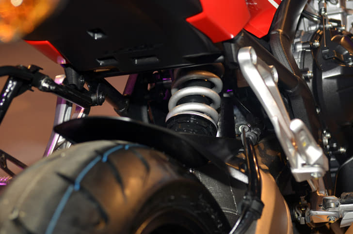 A single shock with spring-preload adjustability; 5.0 inches travel performs rear suspension duties.