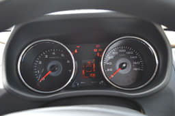 The hooded instrument binnacle with chrome rings and digital info display looks smart.