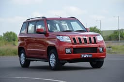 The rugged face has the Jeep-like upright chrome grille, headlamps inspired by the Bolero, and a huge air dam.