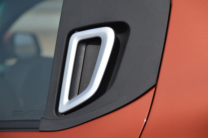 The rear door handles come mounted on the C-pillar. Only the top-end variant gets them finished in silver though.