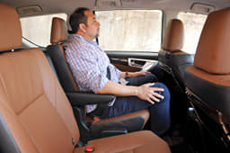 The middle row captain seats are generously cushioned, just like the ones up front. They slide back and forth and recline, and can be flipped forward with just one lever.