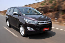 The nose is dominated by the large, two-part grille, with chrome slats at the top and black slats below.