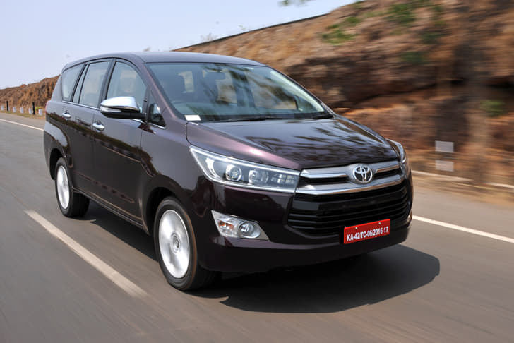 The nose is dominated by the large, two-part grille, with chrome slats at the top and black slats below.