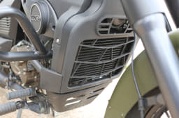 Shrouded heat exchanger for the liquid-cooled engine gives it a cleaner look.