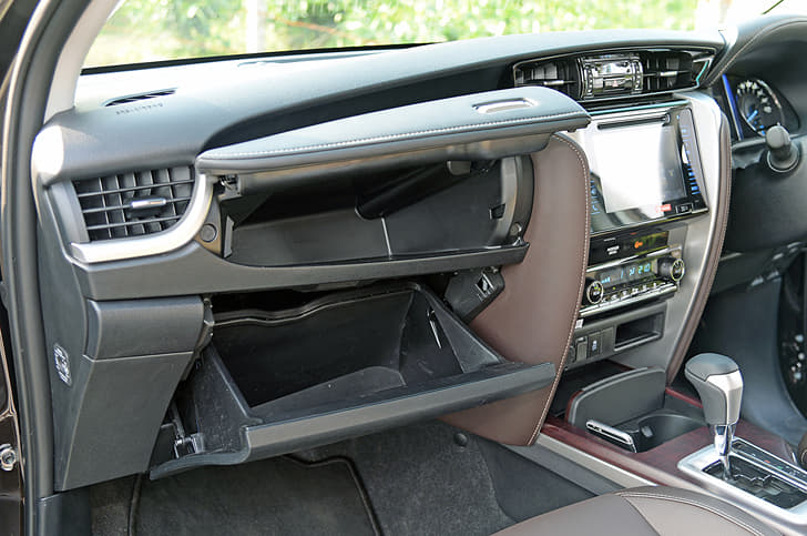 The storage compartments at the top can be cooled, while the one below can be locked.