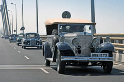 Classic cars and modern bridges make for beautiful drives. 
