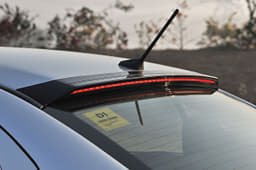 Blackened lip above the rear windscreen is home to auxiliary LED brake lights. Note ridges for roof hump.