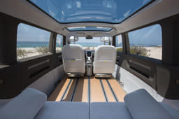 Seating arrangement can be moved using grooves in floor.