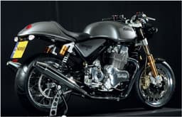 Norton Commando 961 Sport rear three-quarters view in silver.