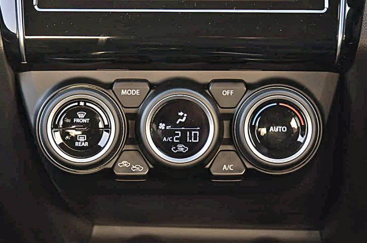 Climate control knobs differ from those on the Dzire. Centre dial comes with inset LED display.