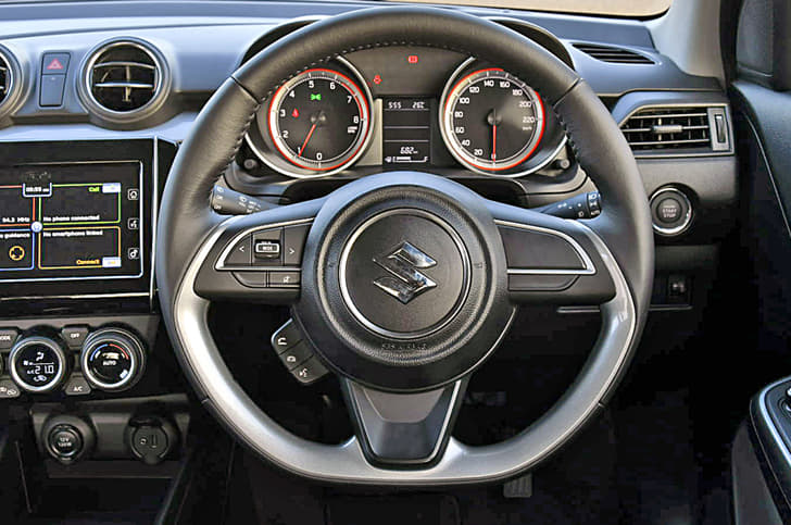Sporty flat-bottomed steering wheel is standard. Steering is leather-wrapped on Z and Z+ versions.