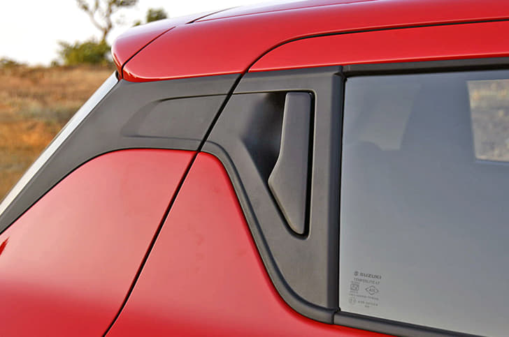 Love it or hate it, but the new Swift's rear door release sits just aft the window.