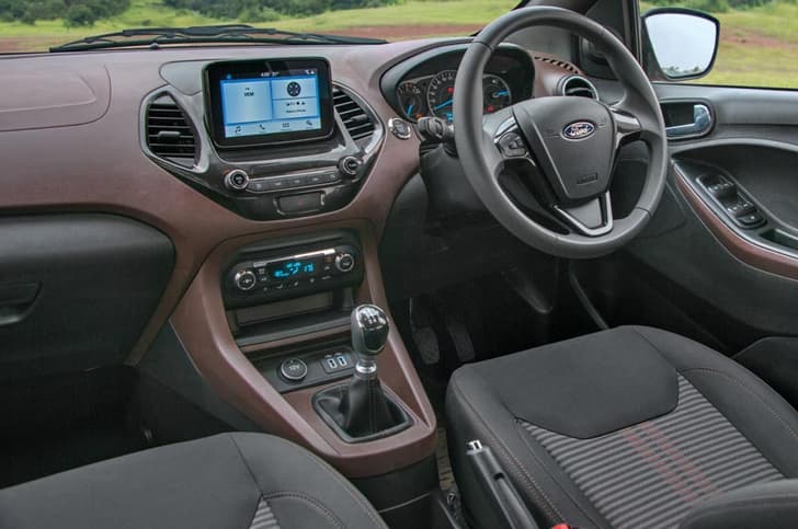 Dash from Figo but restyled to house touchscreen. Brown-on-black theme is interesting.